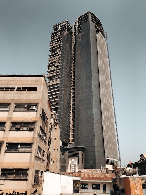 A High Rise Concrete Building Under Gray Sky