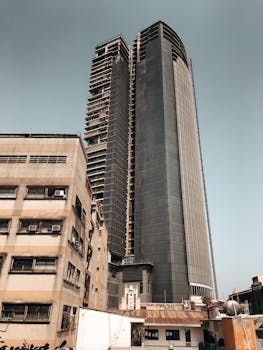 Tall skyscraper against a gray sky in Ho Chi Minh City, Vietnam.