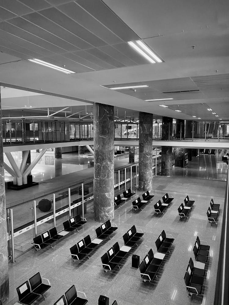 Grayscale Photo Of An Empty Airport Terminal