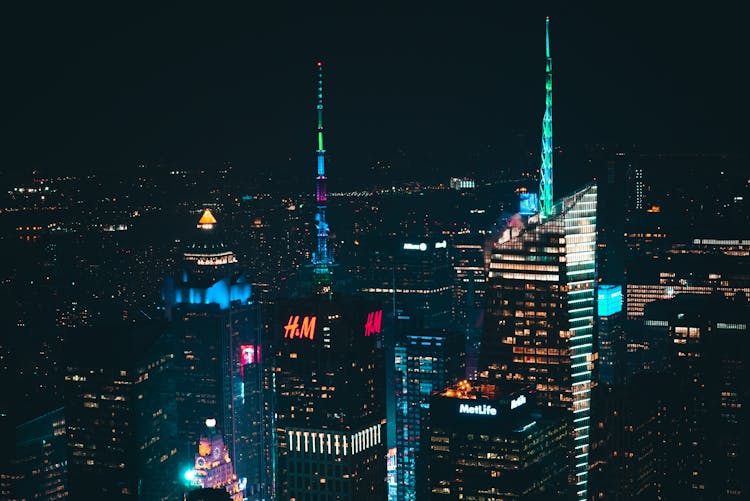 Illuminated Megapolis With Futuristic Skyscrapers Under Night Sky