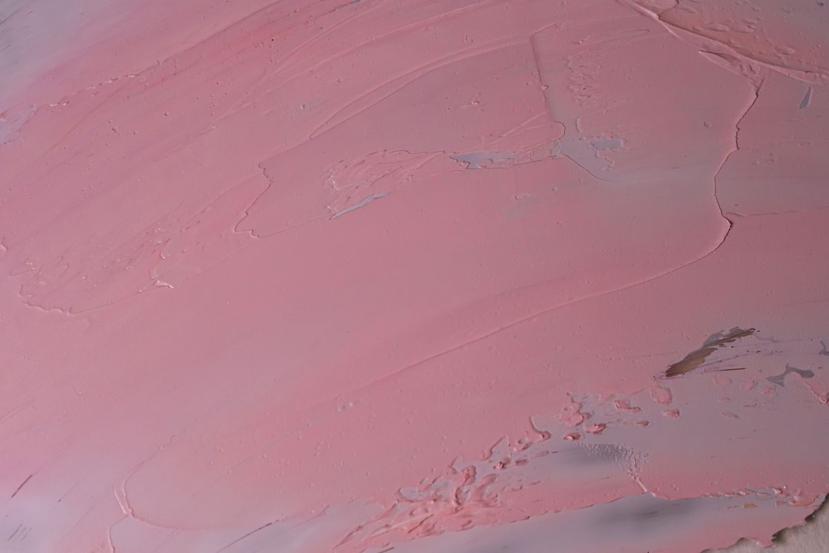 Close-up of a pink textured surface with brush strokes — photo by Polina on Pexels