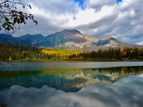 Free Green Trees Near Lake and Mountain Under White Clouds Stock Photo