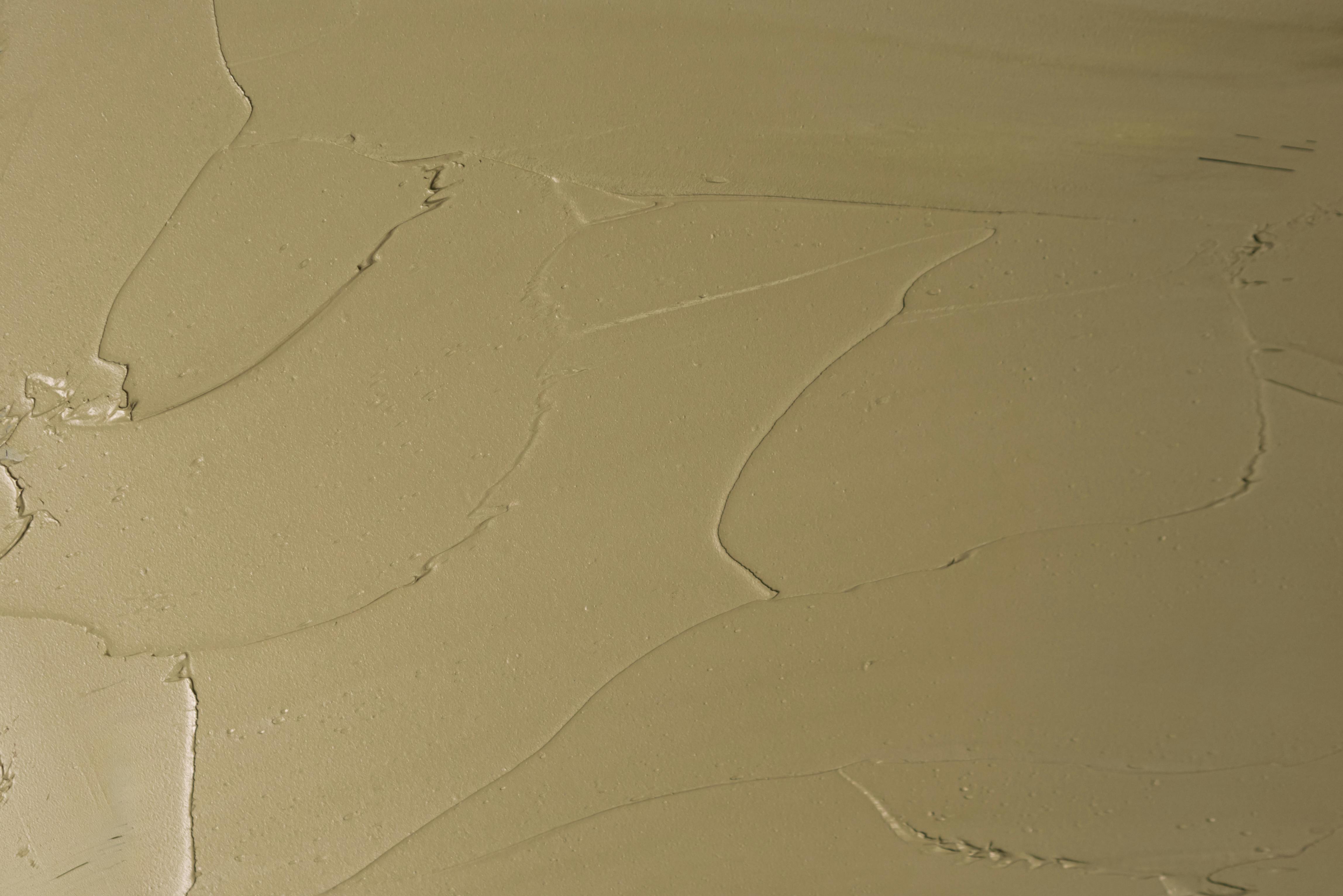 High-resolution abstract texture of a beige surface, perfect for backgrounds and artistic designs.