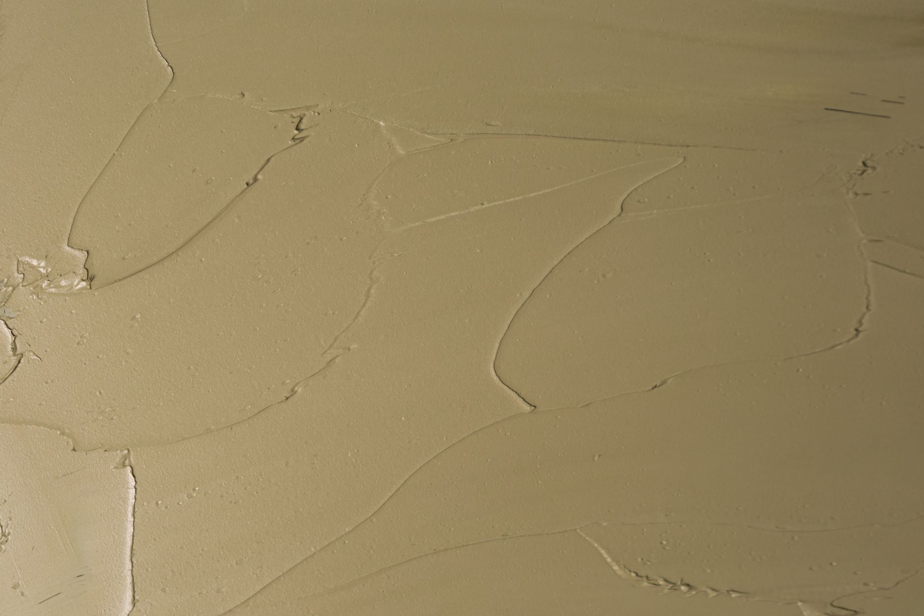 High-resolution abstract texture of a beige surface, perfect for backgrounds and artistic designs.
