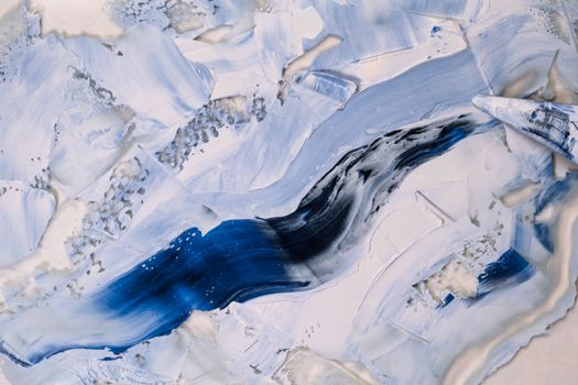 A dynamic abstract painting featuring blue and white textures, resembling Arctic landscapes.