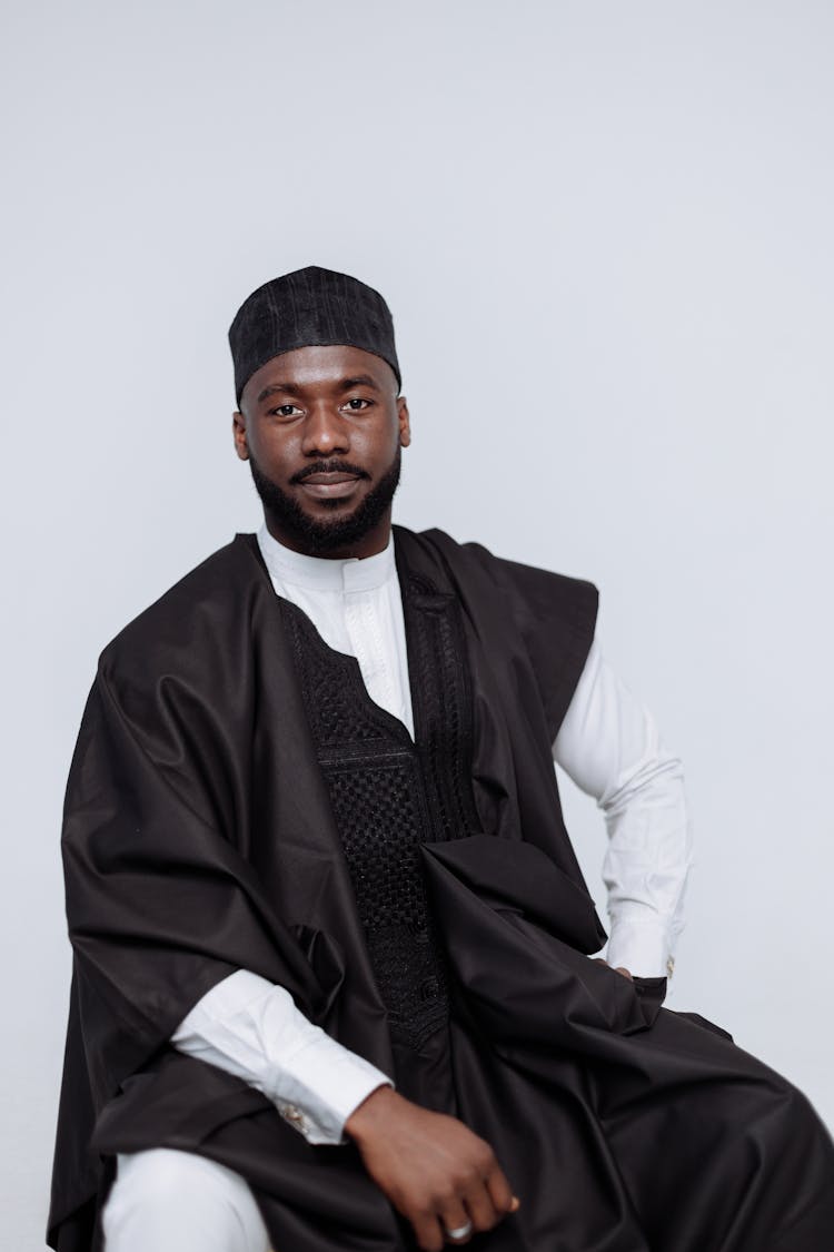 Man In Black And White Long Sleeve Shirt And Black Knit Cap