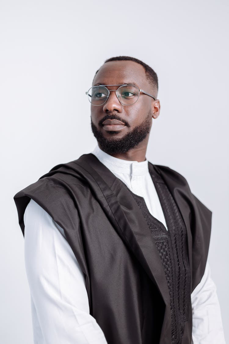 Man In White Long Sleeves Shirt And Black Toga