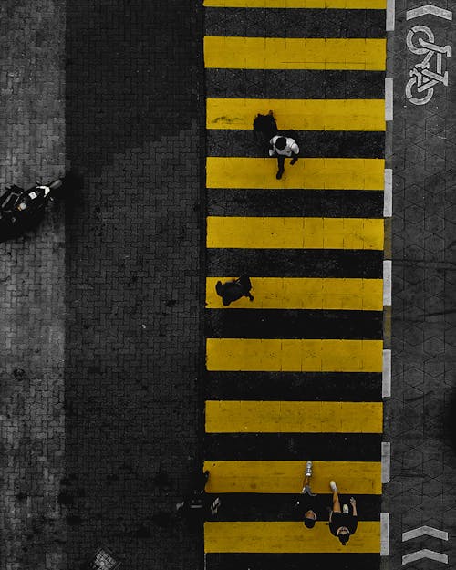 Drone Shot of People Crossing the Street