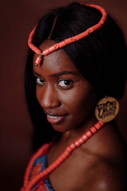 A Woman Wearing a Necklace on Head