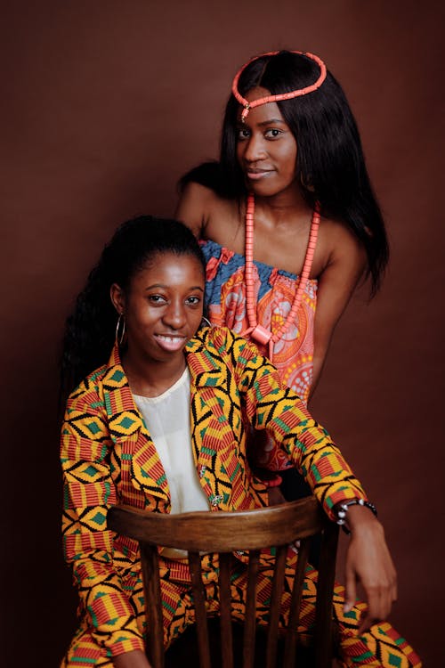 Women Posing Together Wearing Colorful Clothes