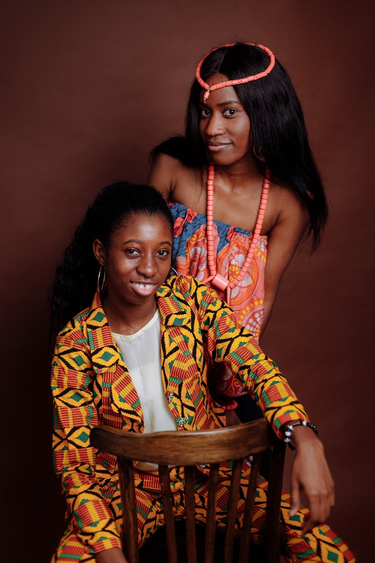 Women Posing Together Wearing Colorful Clothes