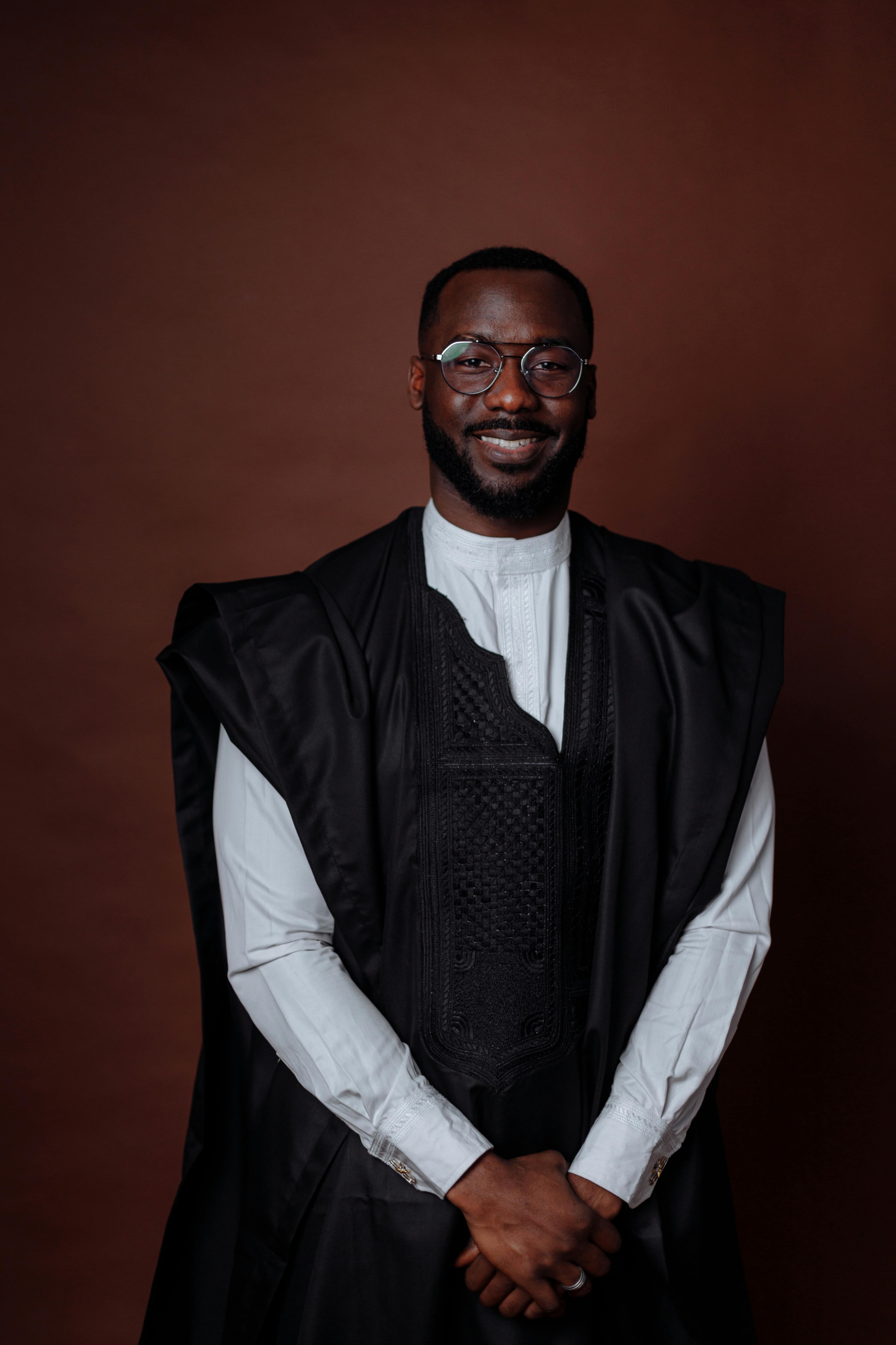 A Man in Black Vest and White Long Sleeve Shirt · Free Stock Photo