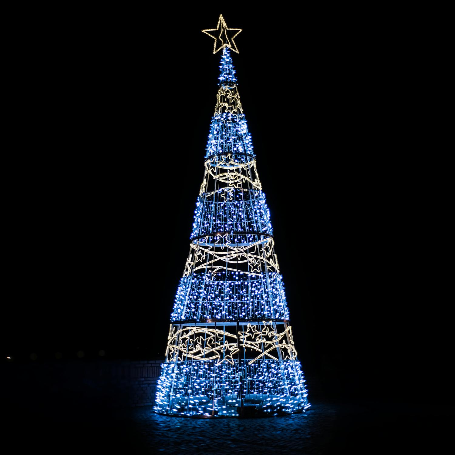 Glowing Christmas tree in darkness · Free Stock Photo