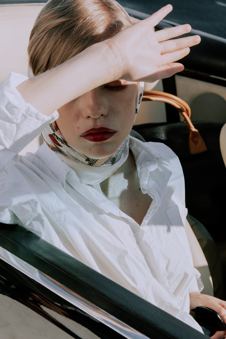 A Beautiful Woman Blocking Sun With Hand