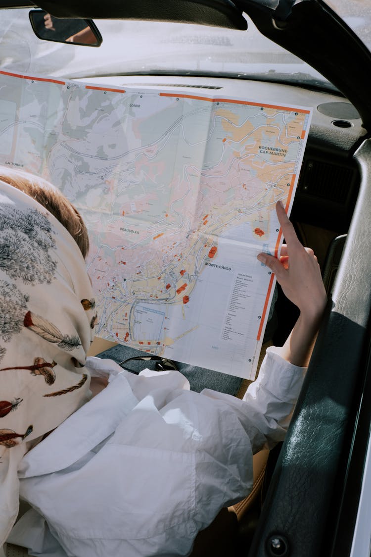 A Woman Holding A Paper Map