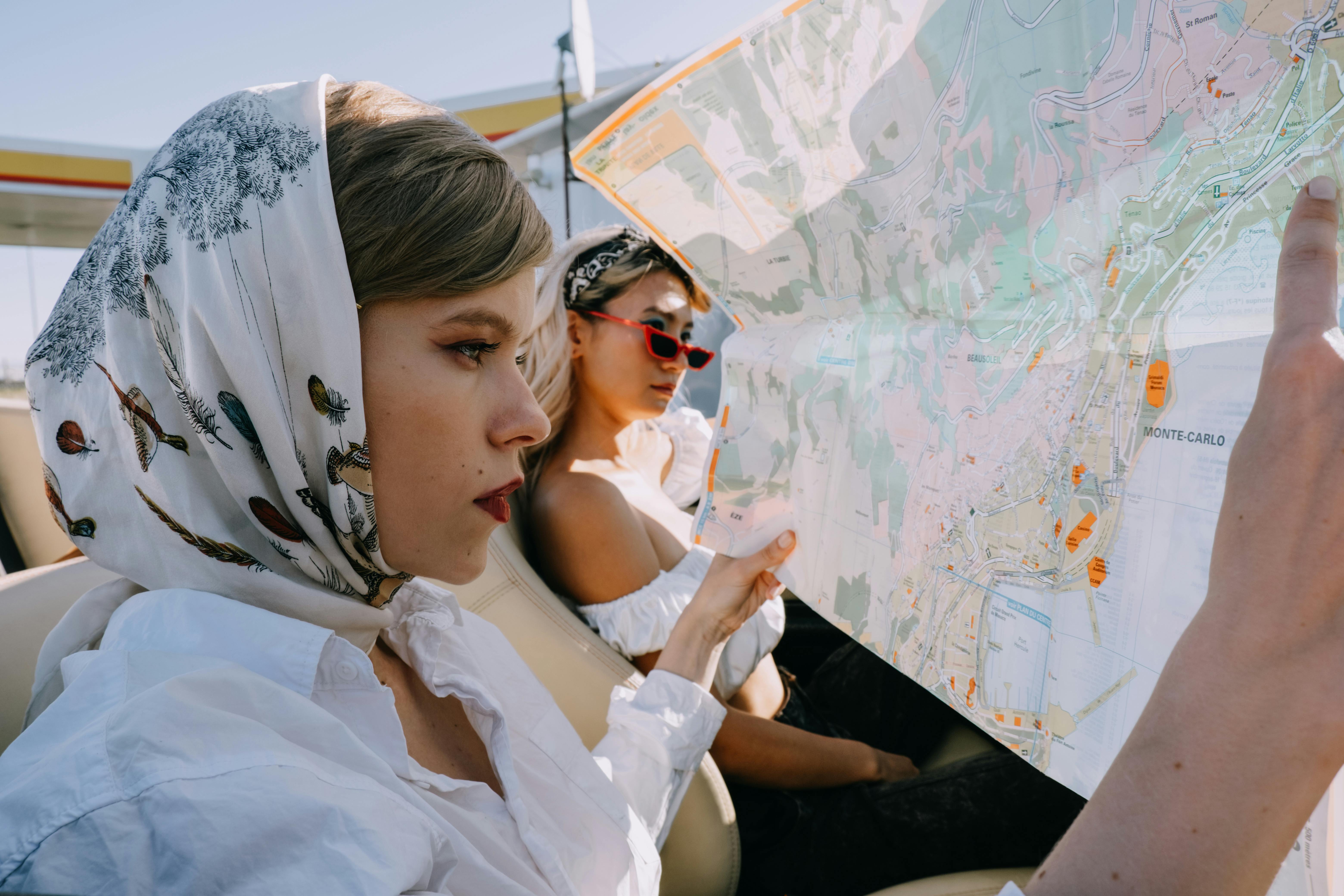 a beautiful woman looking at a map