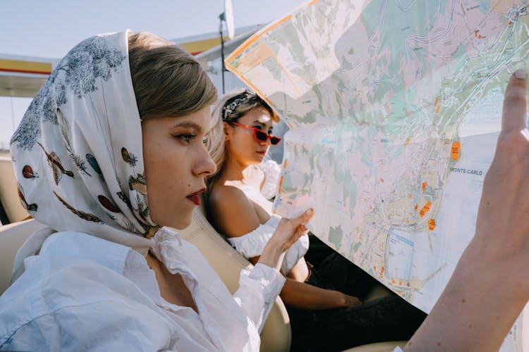 A Beautiful Woman Looking At A Map