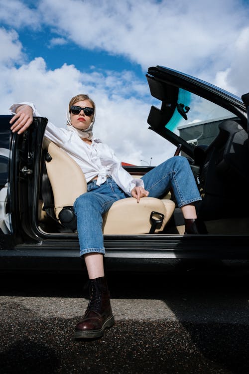 Woman Wearing Sunglasses in a Cabriolet · Free Stock Photo