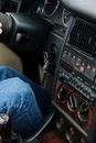 Person in Blue Denim Jeans Sitting Inside Car