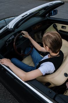 Woman in White T-shirt Driving Car