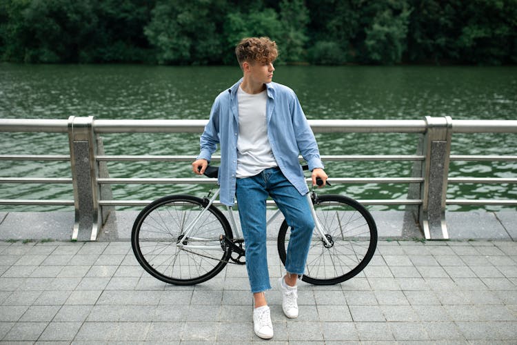 A Man Posing On The Bicycle