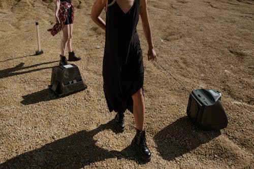 Free People Dragging Televisions on the Ground Stock Photo