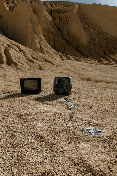 Black Crt Tv On Brown Sand