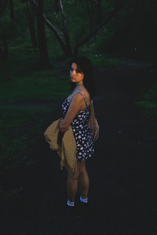 A Woman in Black and White Floral Dress