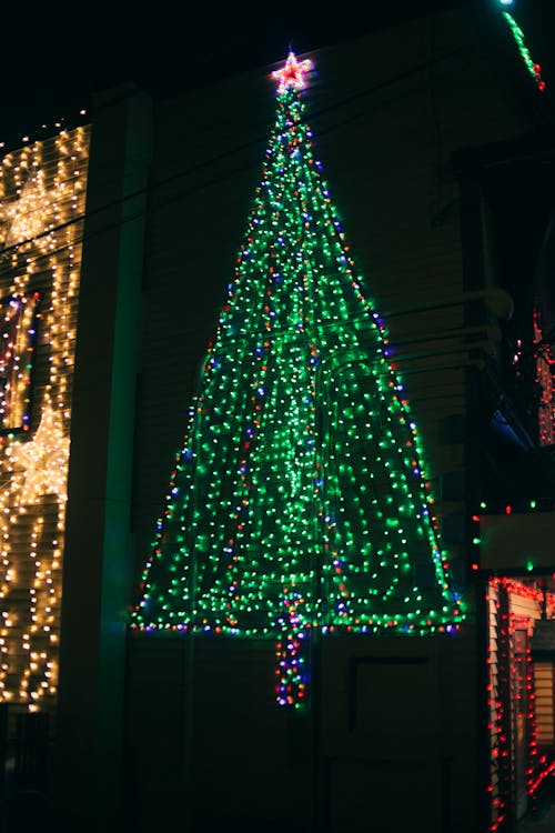Decoration of bright green glowing Christmas tree