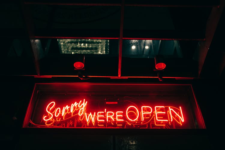 Red Neon Signboard Saying Sorry We Are Open