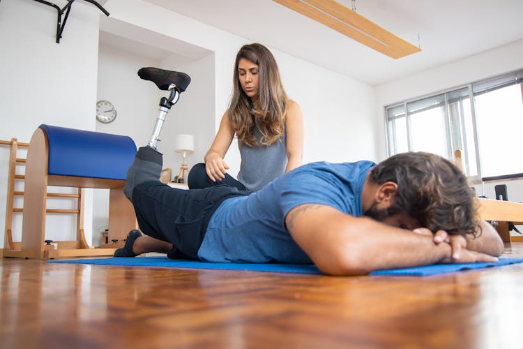 A Man Undergoing  Physical Therapy With Prosthetic Leg