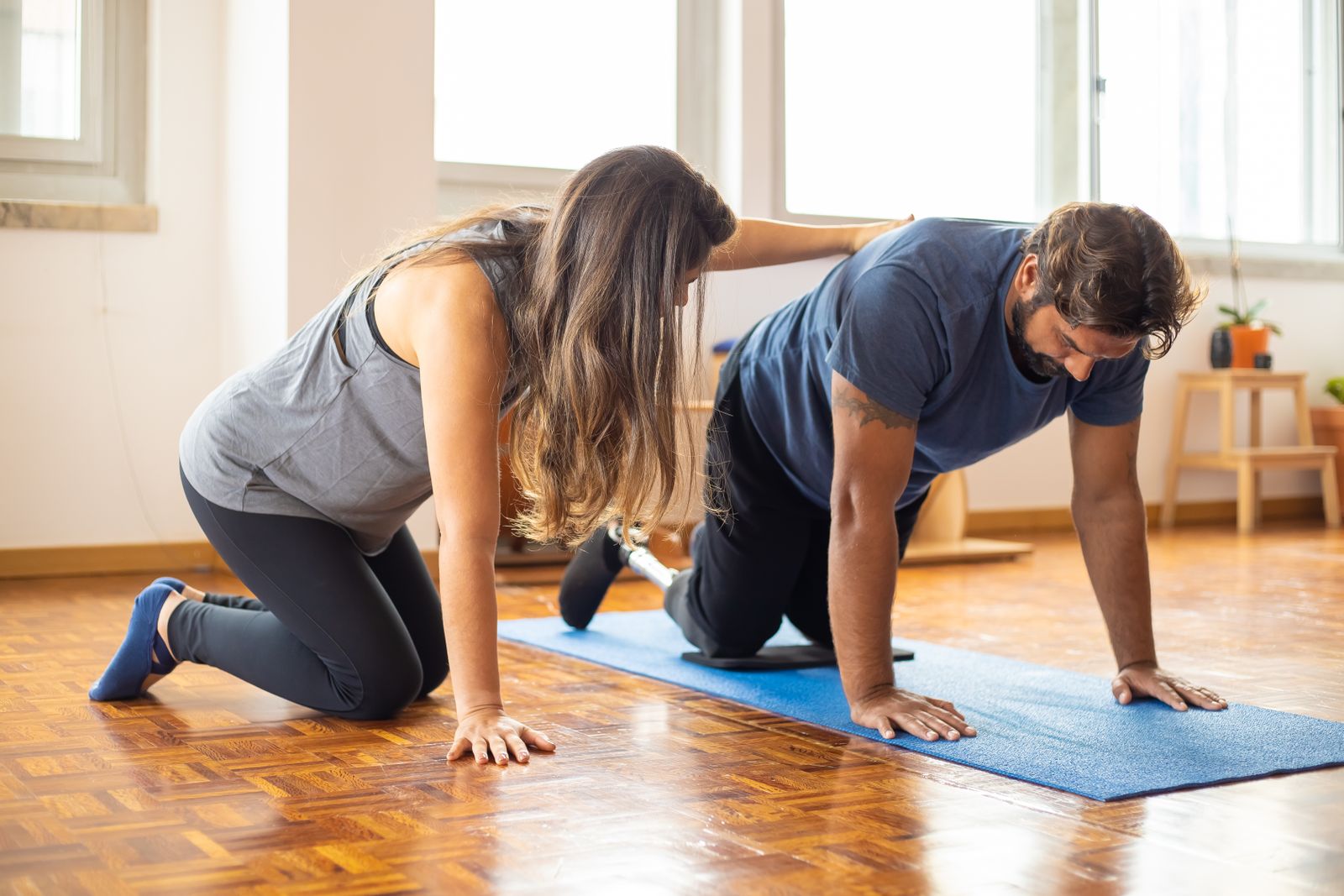 Runner outdoors adjusting a knee support before activity