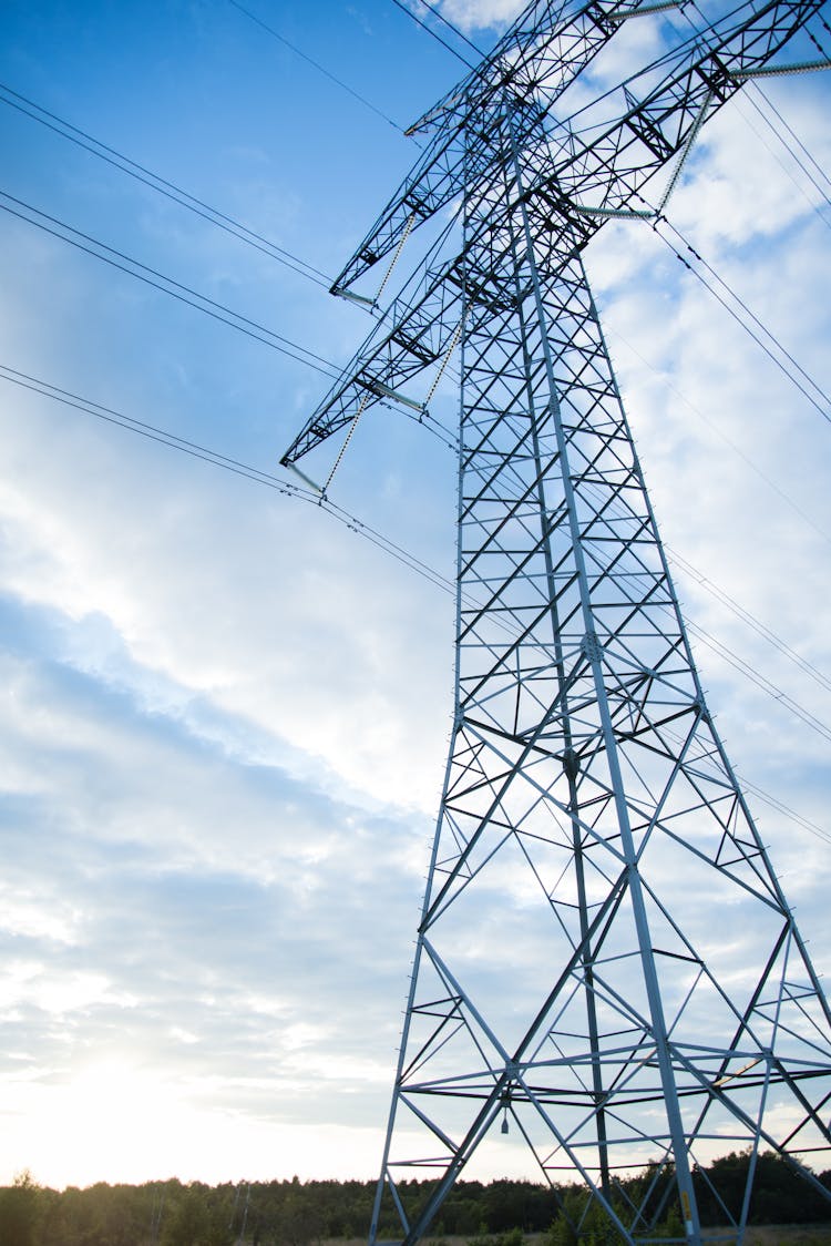 Gray Transmission Line Under Blue Sky At Daytime