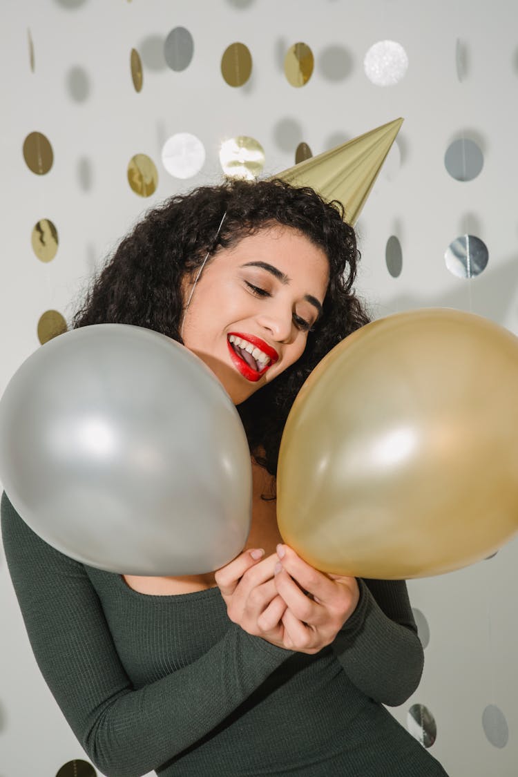 Happy Woman With Balloons In Studio