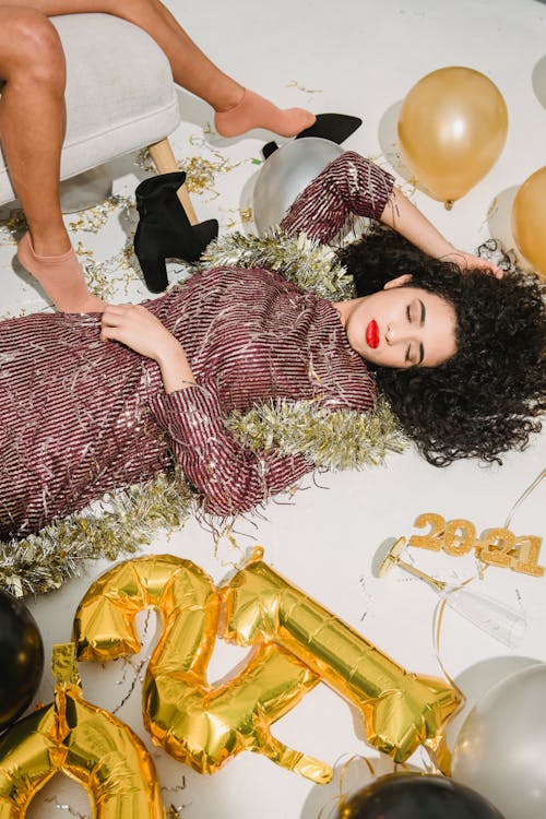 Free A Woman in Red Dress Lying on the Floor Stock Photo