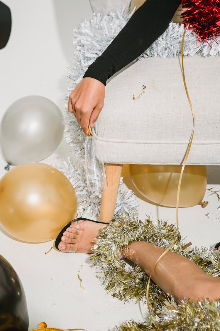 Drunk Women Lying On Sofa And On Floor After Party