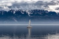 White Sailboat on Body of Water