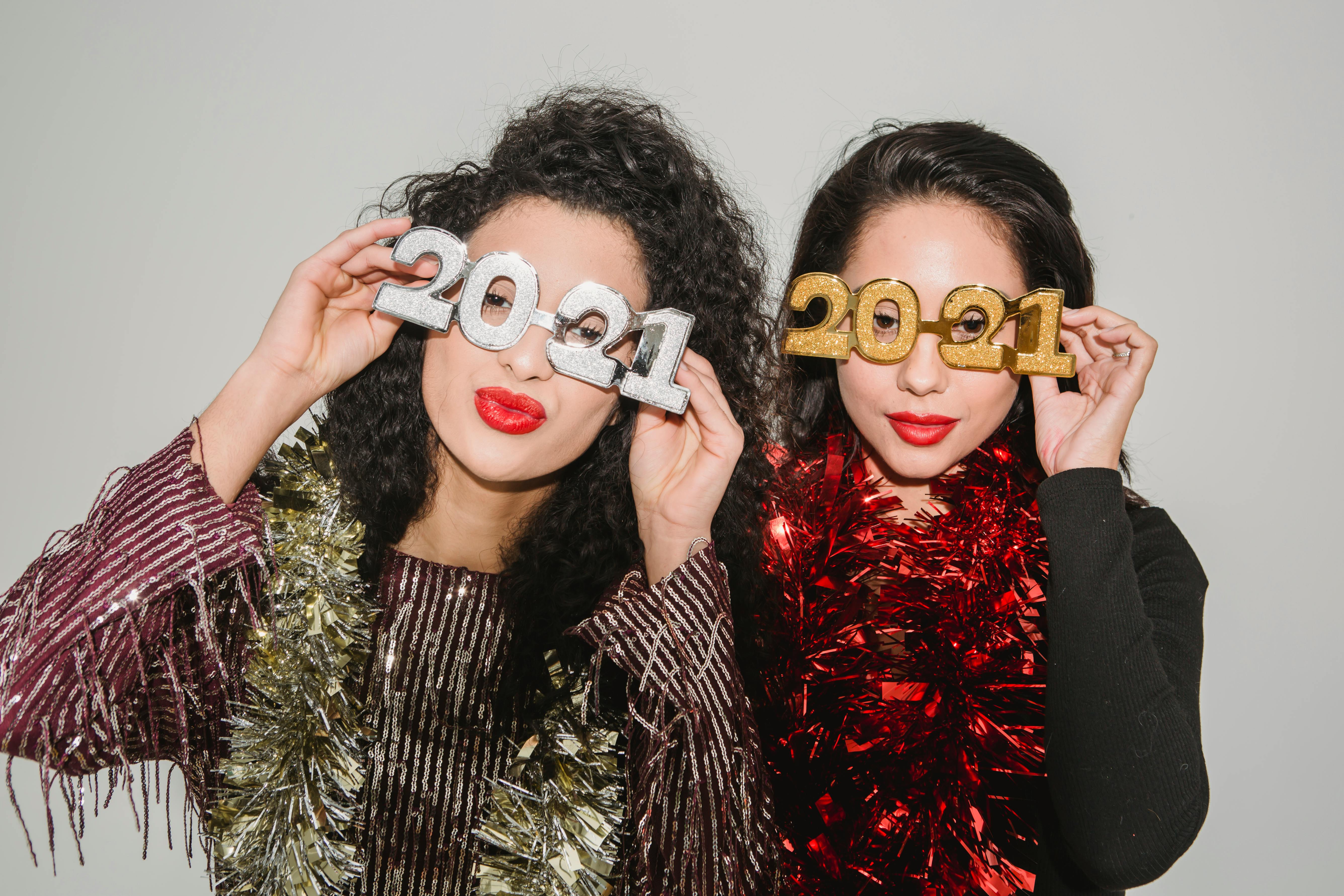 women in decorative eyeglasses in shape of numbers