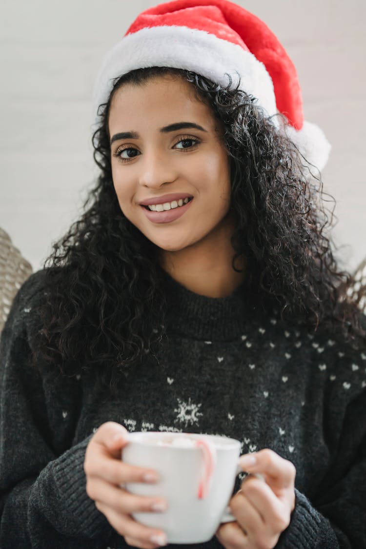 Smiling Ethnic Woman With Hot Chocolate In Christmas