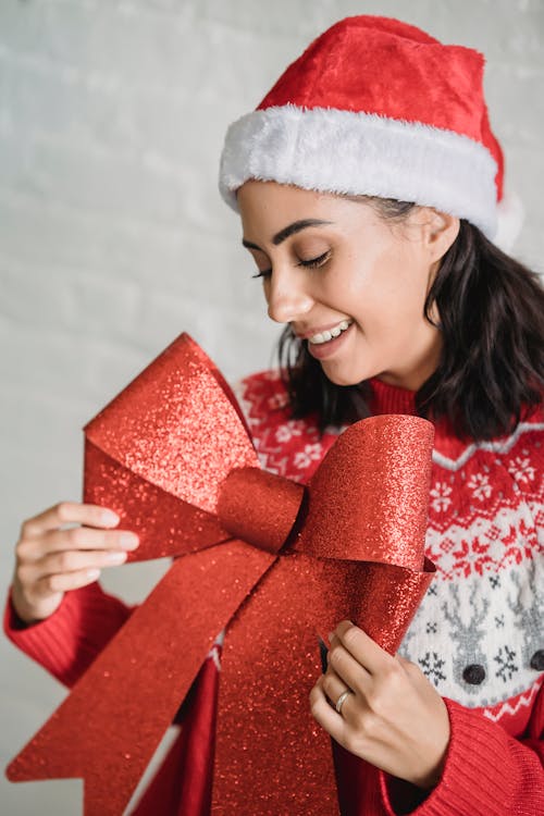 Cheerful woman with Christmas decorations