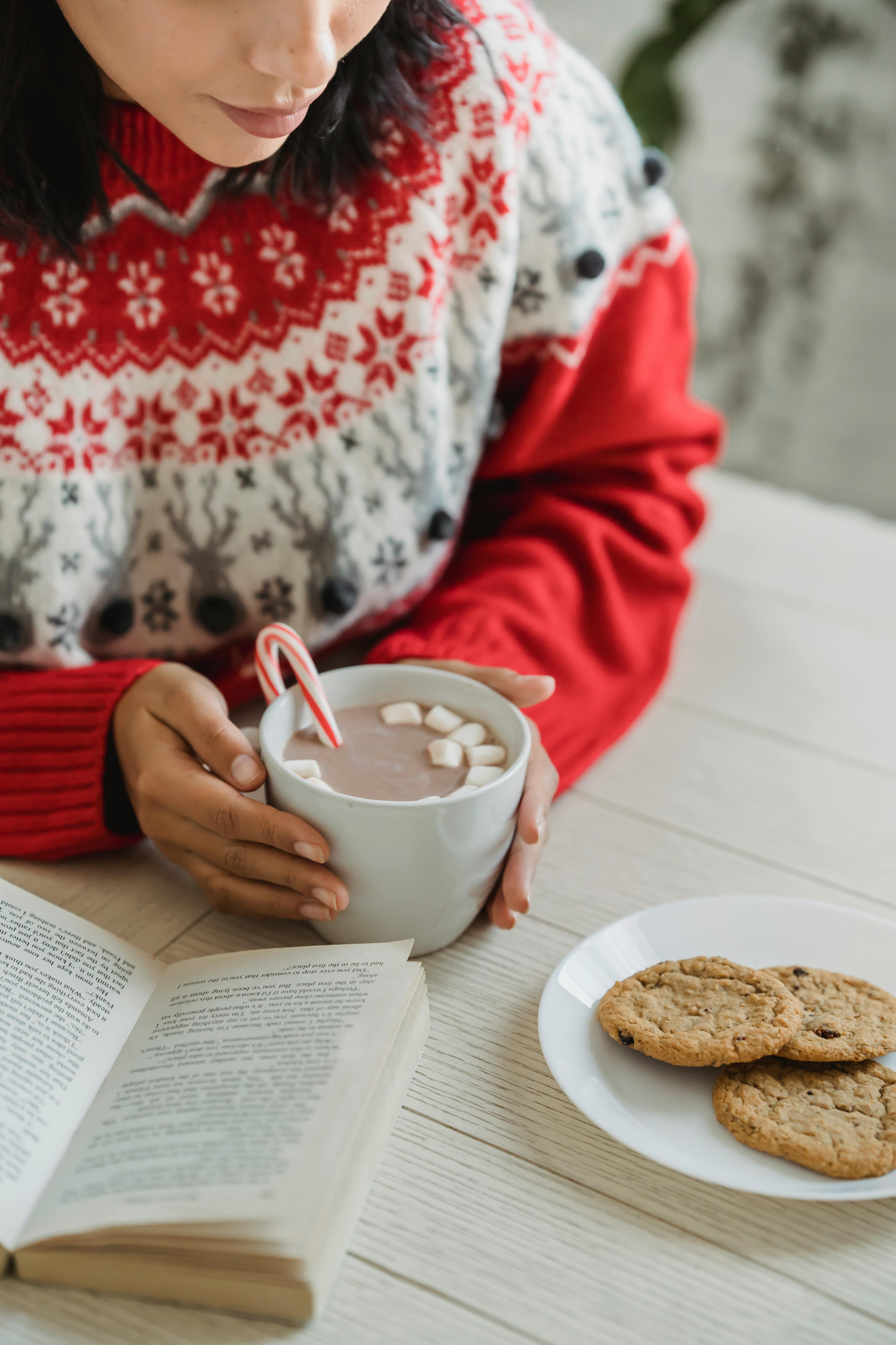 crop woman with cup of hot chocolate