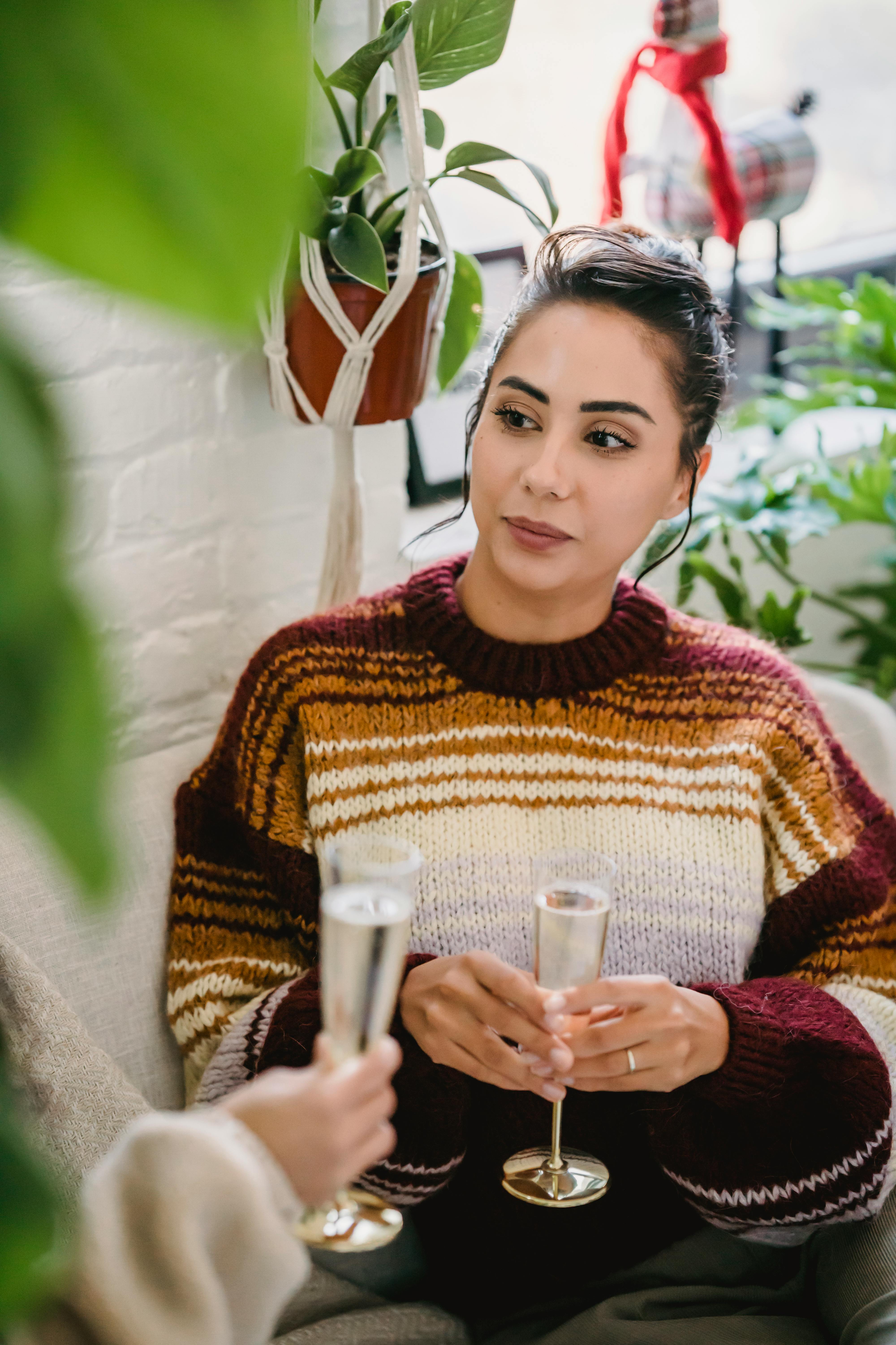 young woman drinking champagne on party