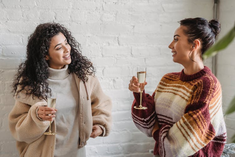 Smiling Ethnic Friends Drinking Champagne During Party