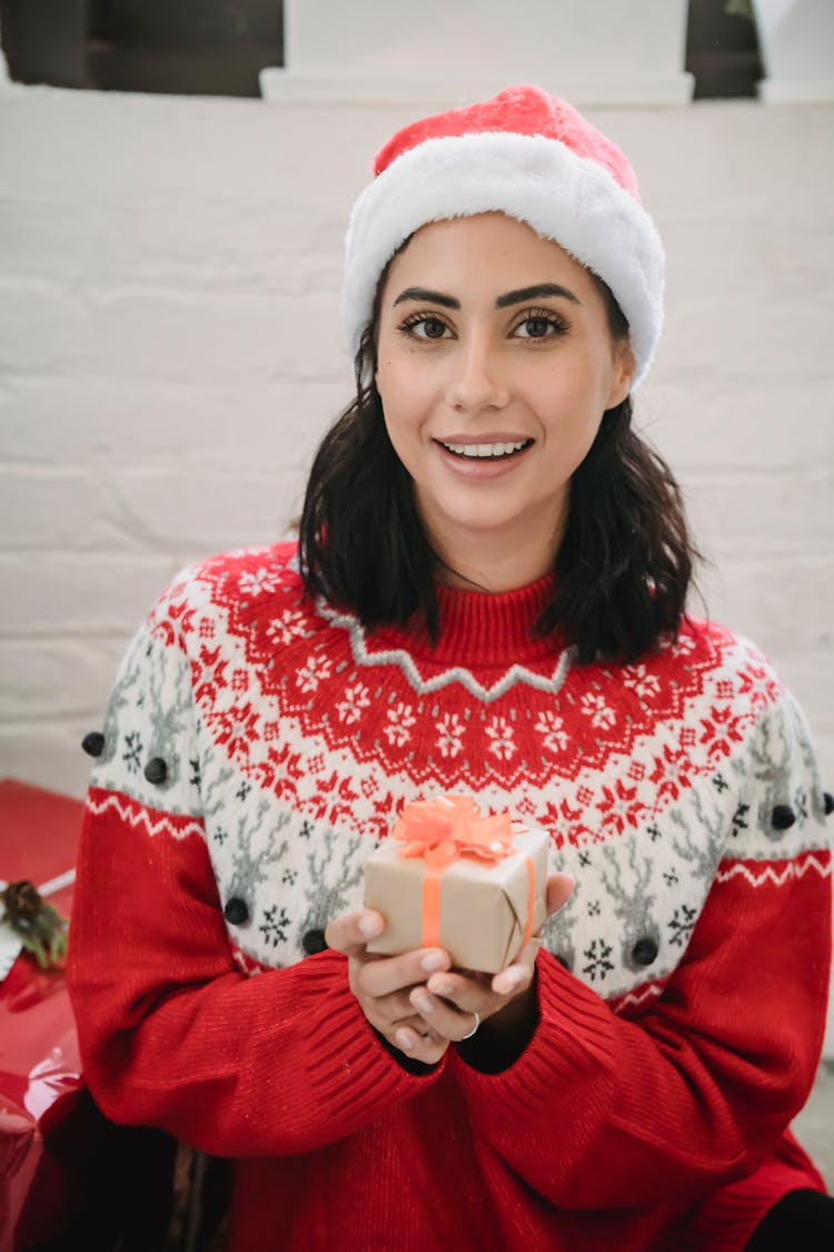 Pretty Woman In Santa Hat With Gift Box