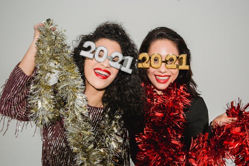 Happy girlfriends having fun at New Year party