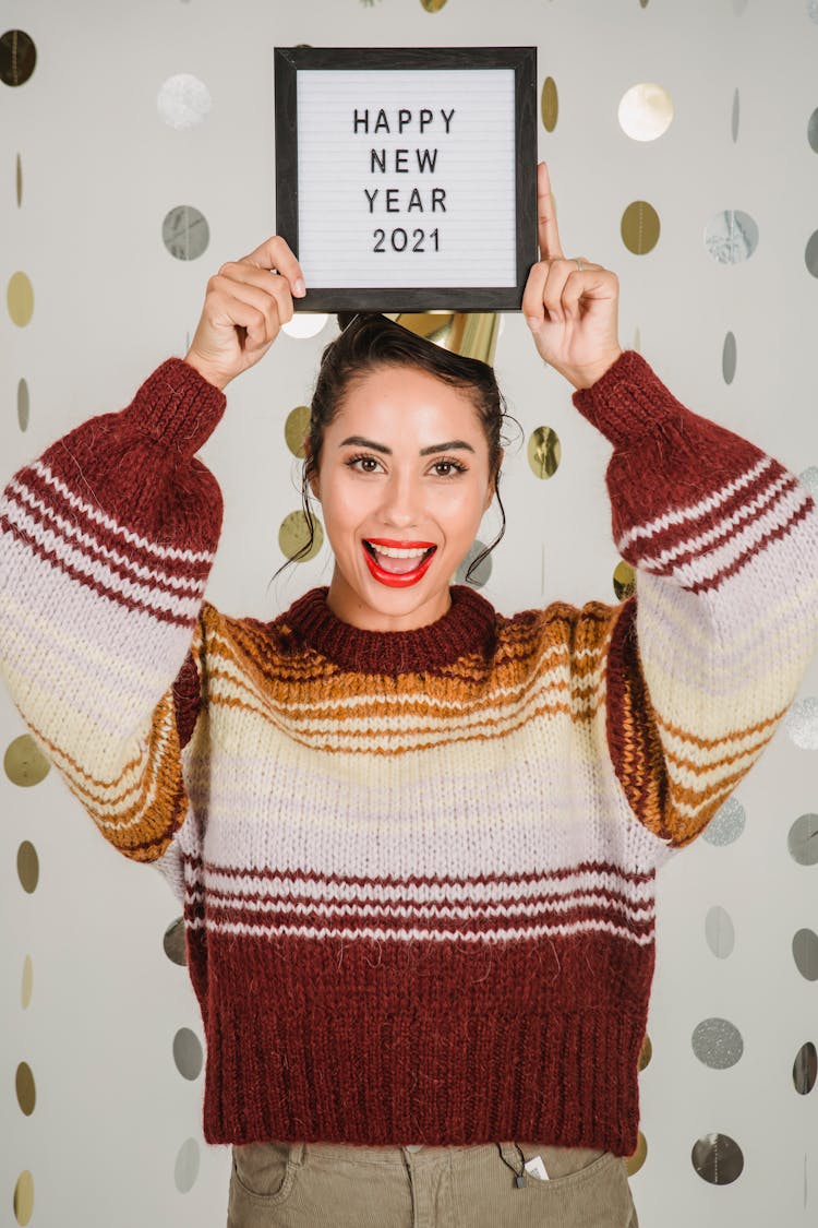 Excited Ethnic Woman Showing Frame With Congratulation Of New Year