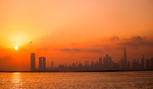 Silhouette of City Skyline during Sunset