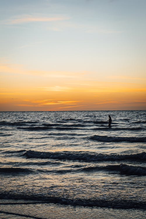 A Person Standing on the Sea 