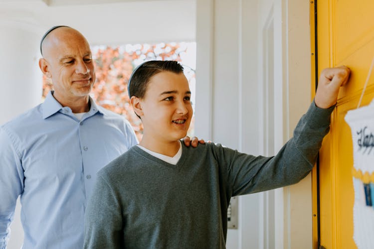 Photo Of Boy Knocking On The Door