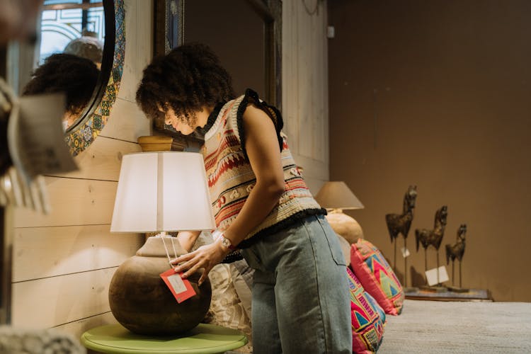 Woman Checking A Lampshade